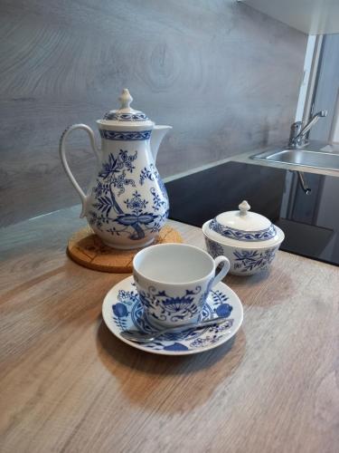 two blue and white cups and saucers on a table at Penzion U strejčků in Veselí nad Lužnicí