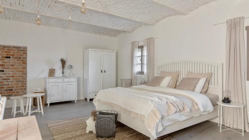 Cama o camas de una habitación en Domačija Pri Momi