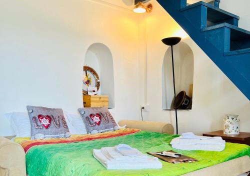 a bedroom with a bed with towels on it at Vesuvio Inn Guest House e Wine Experience in Boscotrecase