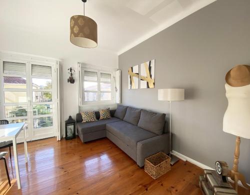 a living room with a couch and a table at MyNookLisbon in Lisbon