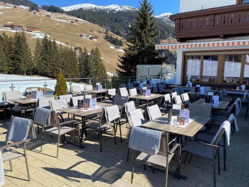 a group of tables and chairs on a patio at Gast- und Ferienhof Christler in Tux