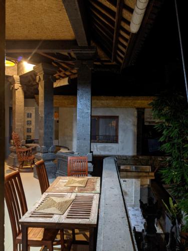 a dining room with a table and chairs at Ubud Dream in Ubud