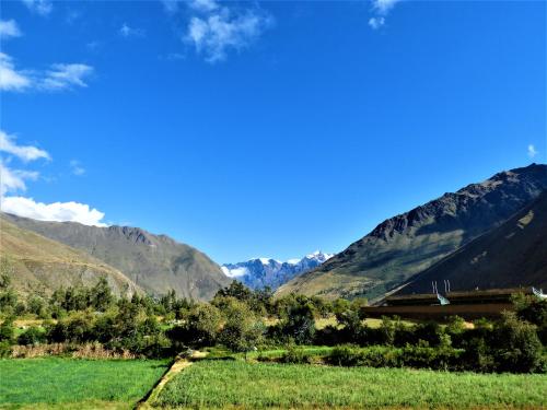 a view of a valley with mountains in the background at Ayllu B&B Ollantaytambo in Ollantaytambo