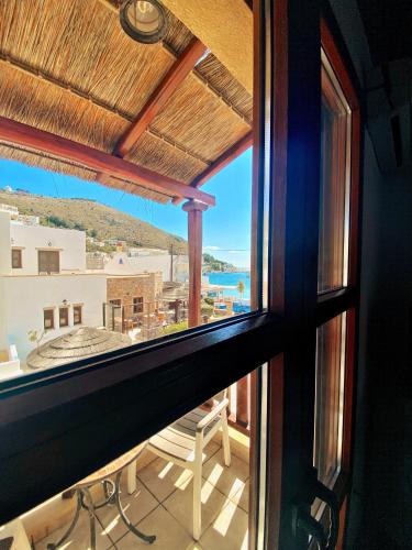 a view from a window of a balcony with a view at Panteli Beach Hotel in Panteli