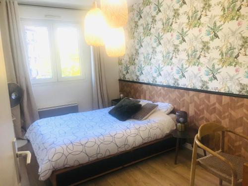 Ένα ή περισσότερα κρεβάτια σε δωμάτιο στο Nid Douillet - BEL APPARTEMENT avec GARAGE