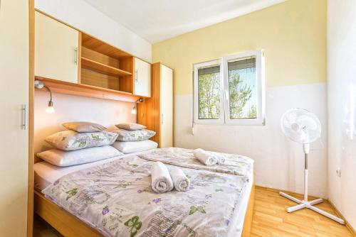 Posteľ alebo postele v izbe v ubytovaní Apartments Marko Dominik