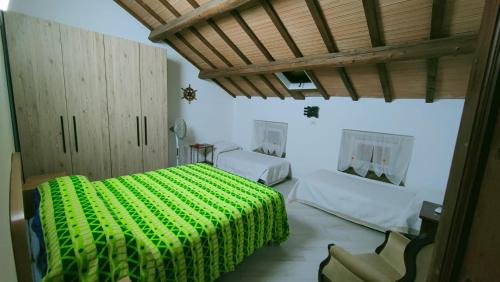 Ένα ή περισσότερα κρεβάτια σε δωμάτιο στο Casa vacanze amedeo