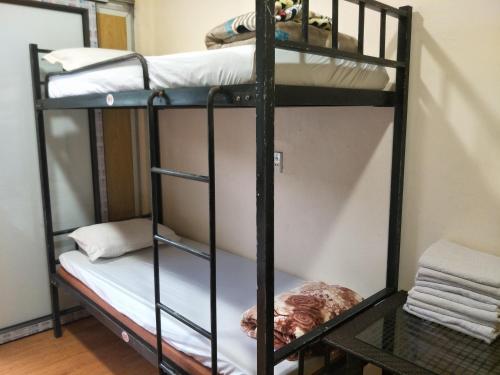 a couple of bunk beds in a room at Ngan Ha Homestay in Ha Giang