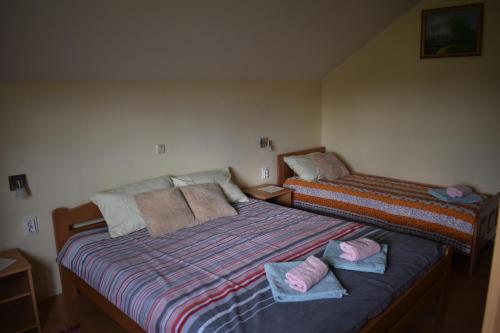 Postel nebo postele na pokoji v ubytování Apartments Sabljak