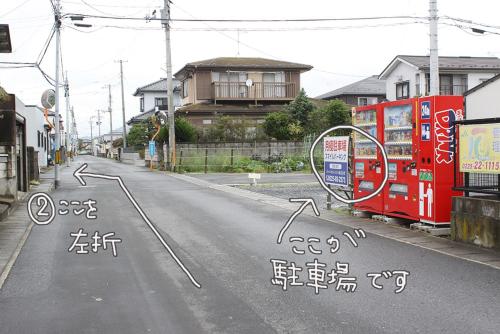 a street with graffiti on the side of the road at コトのアート研究所 in Ishinomaki