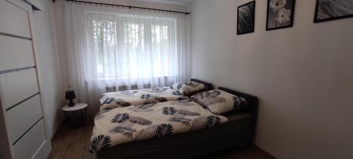 Posteľ alebo postele v izbe v ubytovaní Apartamenty AgPa7