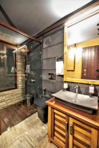 a bathroom with a sink and a toilet at BluSalzz Homes - The Himalayan Bungalow, Almora - Uttarakhand in Almora