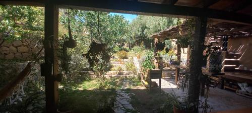 a view of a garden from the inside of a house at Apartamento en el vivero in Tilcara