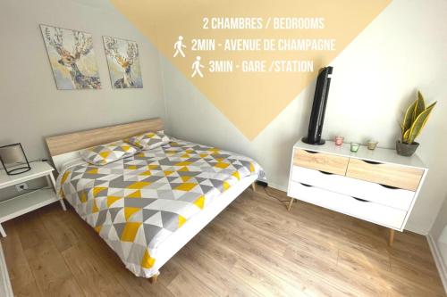 a bedroom with a bed and a sign on the wall at BOUCHON POUR 4 Avenue de Champagne à 3 minutes in Épernay