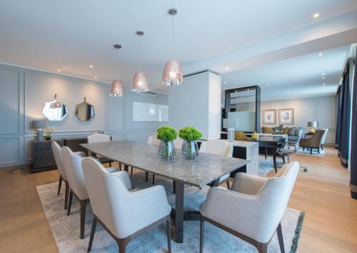 a dining room with a table and chairs at Radisson Blu Hotel, Nairobi Upper Hill in Nairobi
