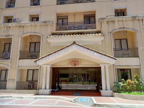a building with an entrance to a building at Taj's Condotel in Manila