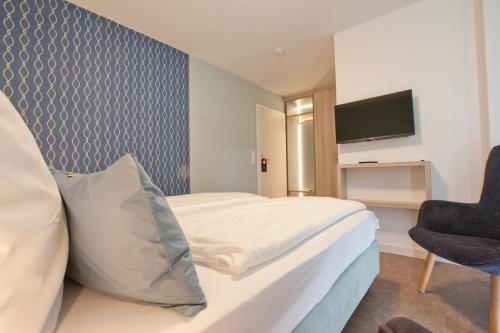 Телевизор и/или развлекательный центр в Hotel Garni Goldener Anker