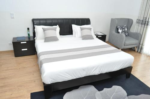 Ένα ή περισσότερα κρεβάτια σε δωμάτιο στο Hôtel Sky blue Mada