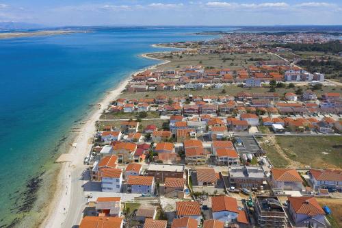 an aerial view of a town next to the beach at Malo Fali in Vir