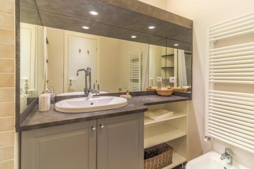 a bathroom with a sink and a mirror at La casa dei Gabbiani by Portofino Homes in Santa Margherita Ligure