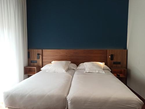 Postel nebo postele na pokoji v ubytování ARVA Spa París