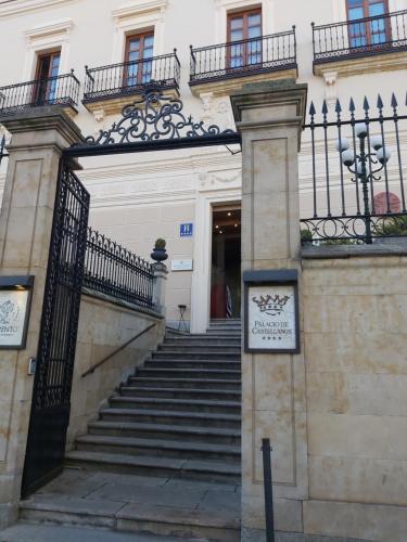 an entrance to a building with stairs and a fence at NH Collection Salamanca Palacio de Castellanos in Salamanca