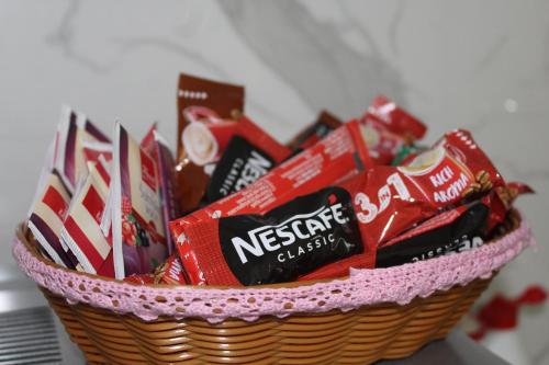 a basket filled with packets of candy at Apartman Amina-Ahmad Vinac-Jajce in Jajce