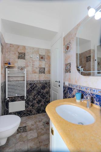 a bathroom with a sink and a mirror at Villa Salice in Amalfi
