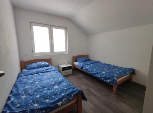 Postel nebo postele na pokoji v ubytování Apartman Amina-Ahmad Vinac-Jajce