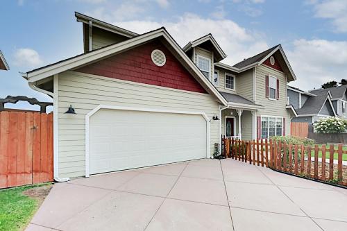 a house with a white garage at Victorian Dream in Arroyo Grande