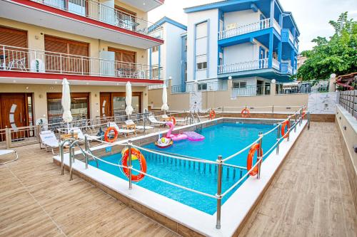 a pool at a hotel with a swimming pool at RENT HOUSE ANEMOS in Iraklitsa