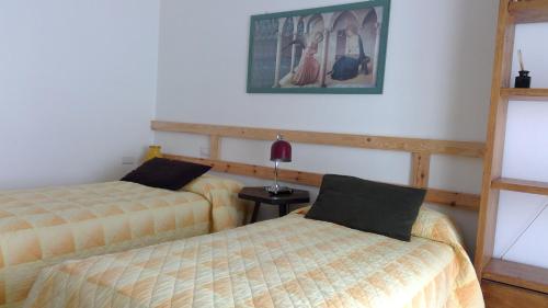 Postel nebo postele na pokoji v ubytování B&B Magenta