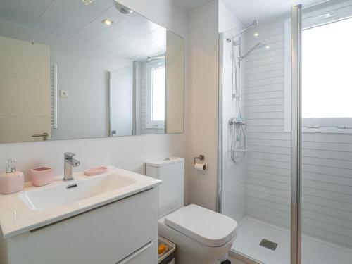 a bathroom with a toilet and a sink and a shower at Via Celere 2376 Beach & Golf in San Luis de Sabinillas