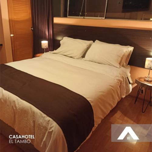 Ένα ή περισσότερα κρεβάτια σε δωμάτιο στο CasaHotel El Tambo Huancayo