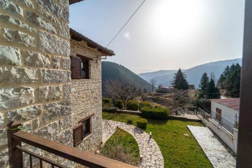 a view of a stone building with a yard at Βίλλα Γαλήνεμα Νο2 in Nóstimon