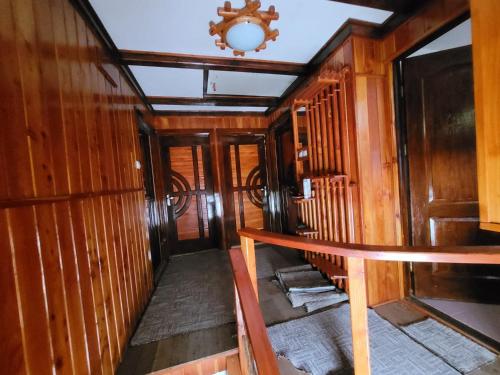 a hallway in a train car with a clock on the ceiling at RUSTIC Vidra in Vidra