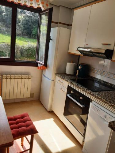 A kitchen or kitchenette at Sellamante2