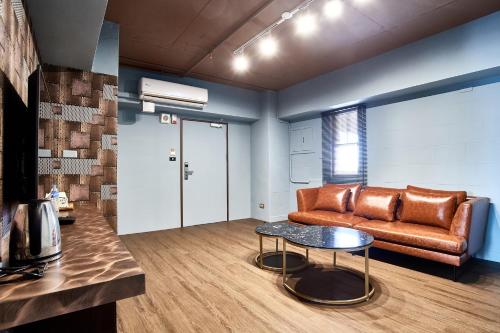 a living room with a couch and a table at 翠安儂風旅 in Taitung City
