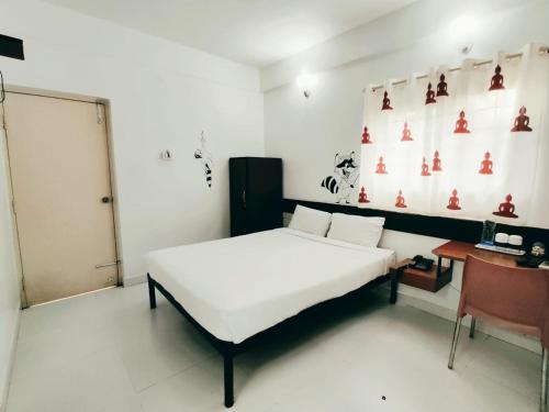 Ένα ή περισσότερα κρεβάτια σε δωμάτιο στο Raccoon Rooms