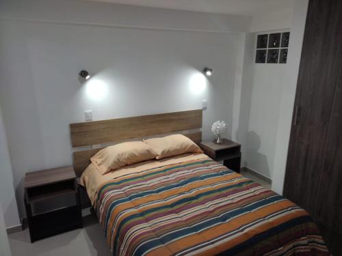 Cama o camas de una habitación en II - Zaguan Aparta Hotel Cusco