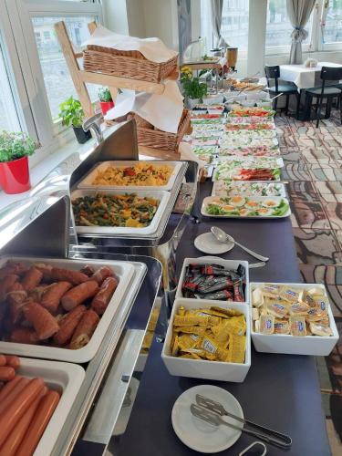 a buffet line with many different types of food at Schronisko na Wyspie in Wrocław