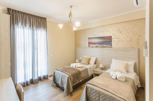 Postel nebo postele na pokoji v ubytování Oasi Perla Del Mare Rooms