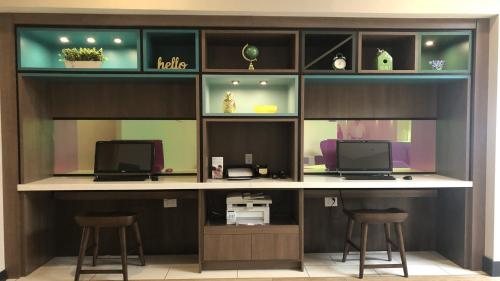 an office with two stools and a desk with two monitors at Holiday Inn Staunton Conference Center by IHG in Staunton