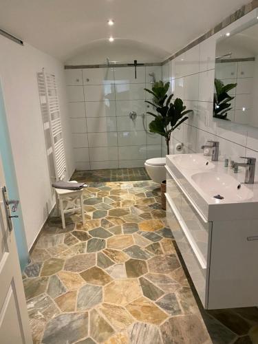 a bathroom with a toilet and a sink and a shower at Schloss Grabow, Resting Place & a Luxury Piano Collection Resort, Prignitz Brandenburg in Grabow