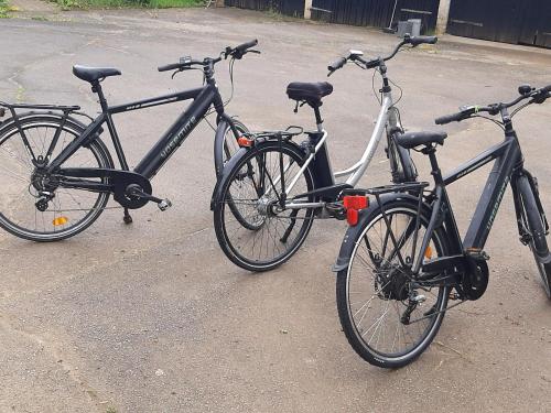 two bikes parked next to each other on a street at Ranch Farm Stay in Rakovica