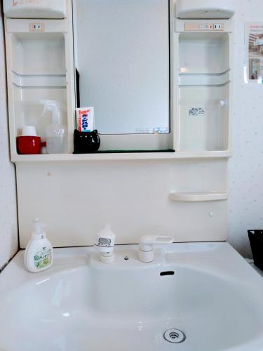 Ванная комната в Osaka Tomato Guesthouse