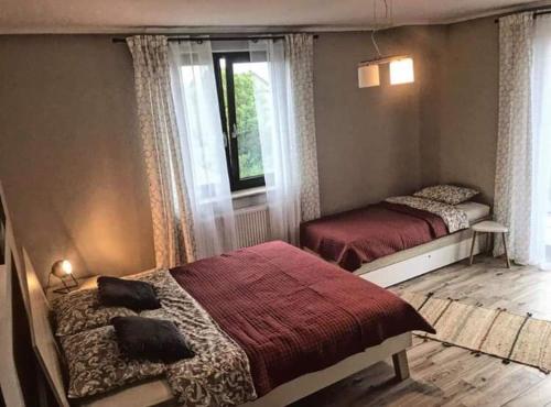 En eller flere senge i et værelse på Morska Ostoja Chłapowo