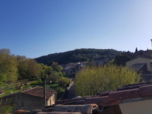 a view of a town from the roof of a building at Romantic Suite in Cabasse