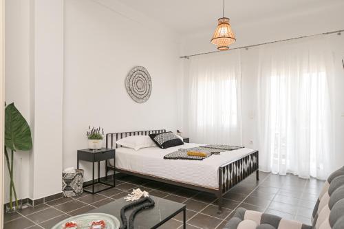Ένα ή περισσότερα κρεβάτια σε δωμάτιο στο Flèria Seaview Suites
