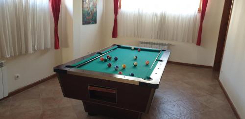 a pool table with balls on it in a room at Free SPA в Св. Иван Рилски - Сладък дом сред лукс in Bansko